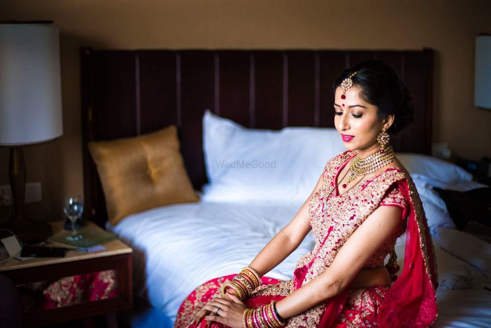Photo of Bridal portrait with bride wearing red lehenga