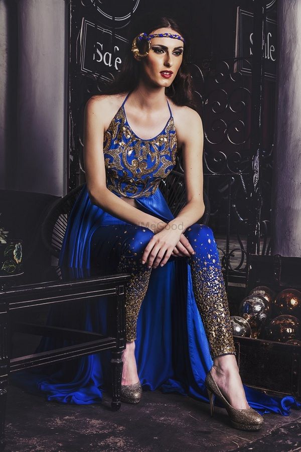 Photo of blue sleeveless halter neck indo western outfit with slit and shimmer pants