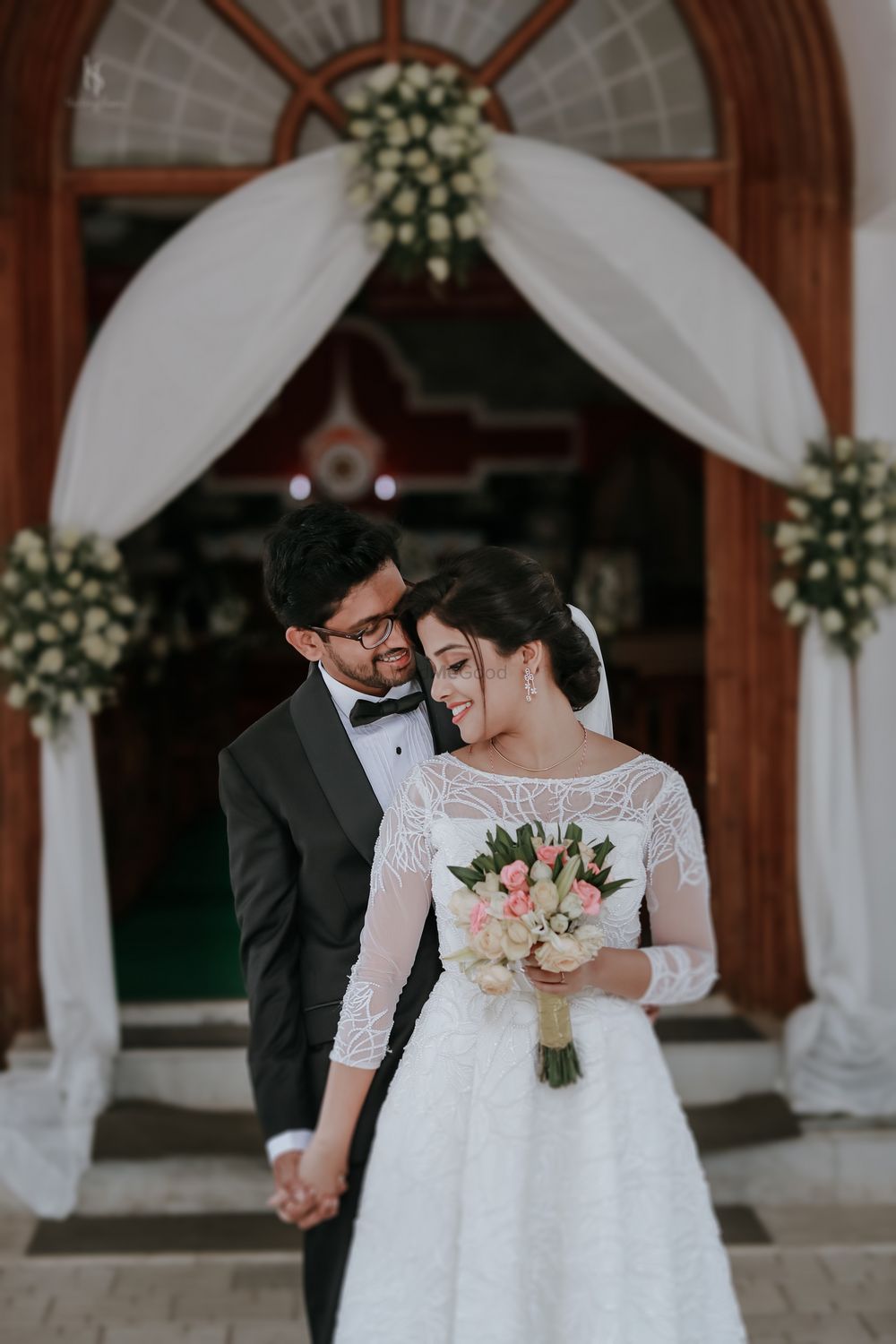 Photo of A Christian couple outside the church after their wedding.