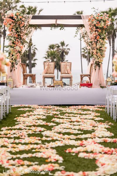 Photo of A floral walkway leading upto a floral mandap setup