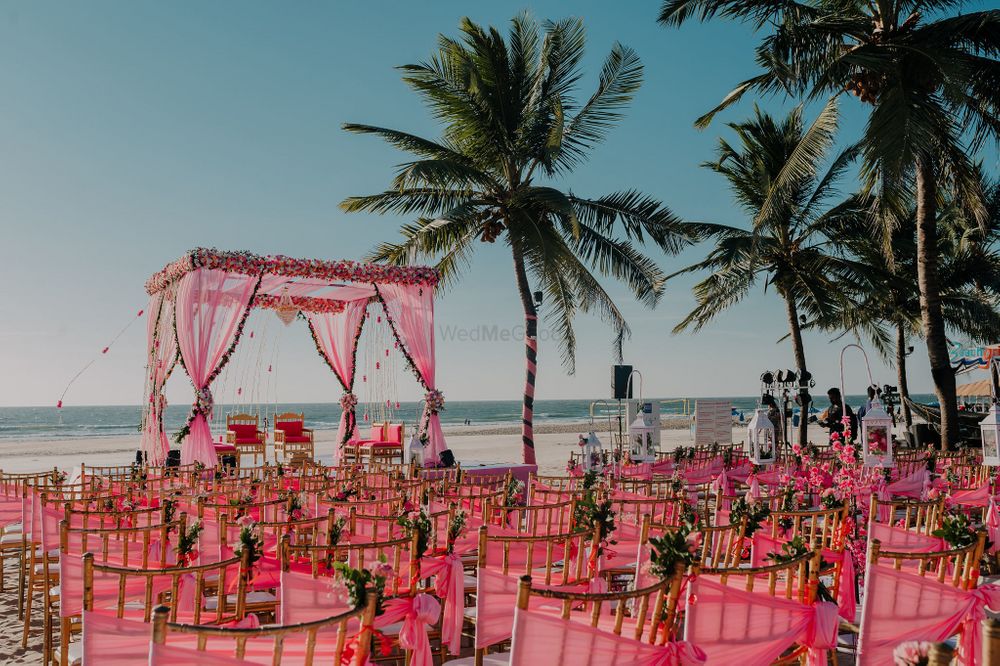 Photo of pink theme decor with mandap and matching chairs