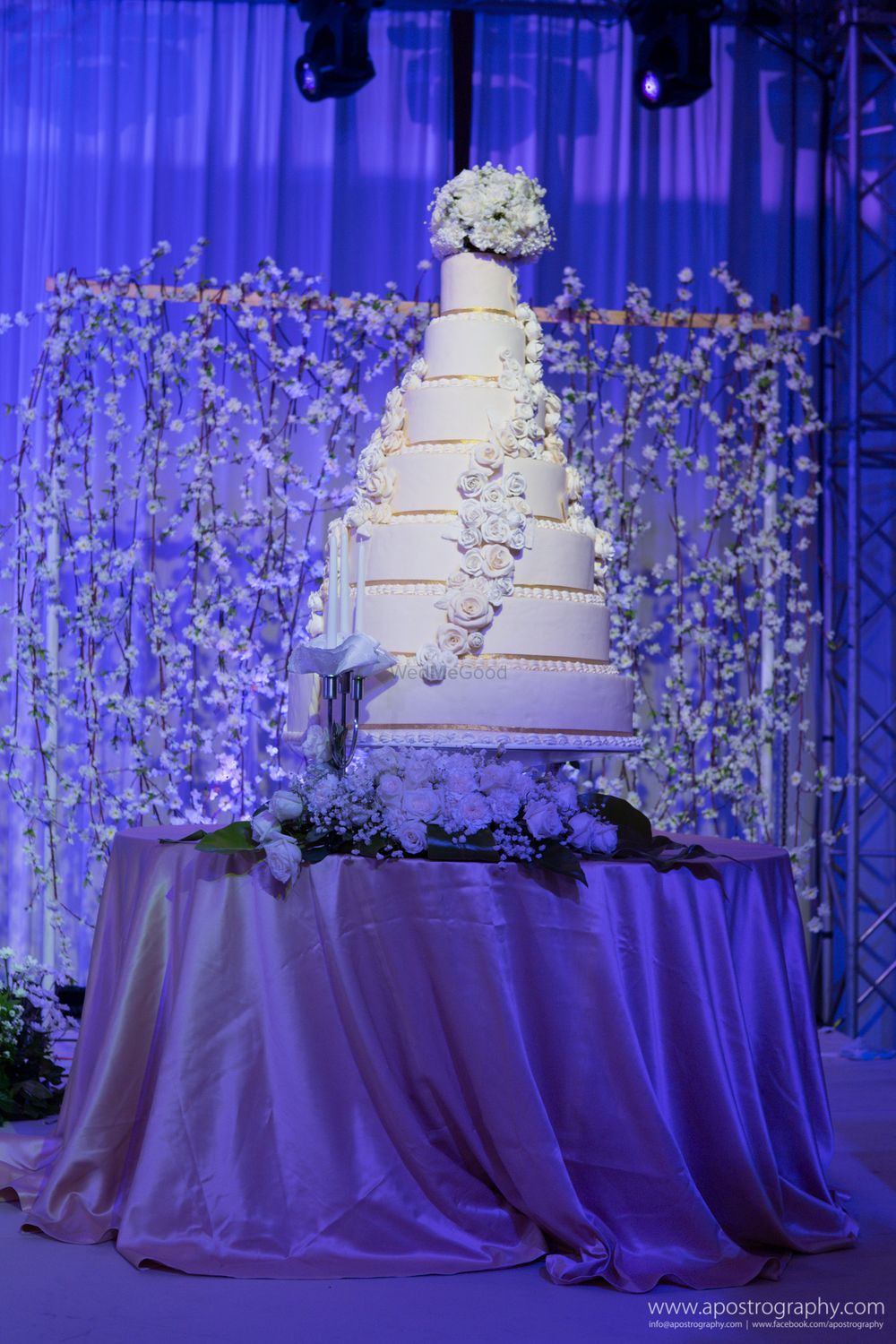 Photo of 7 Tier White Wedding Cake with Floral Cake Decor