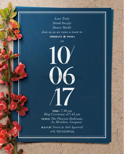 Photo of Minimal and simple wedding card in blue and white
