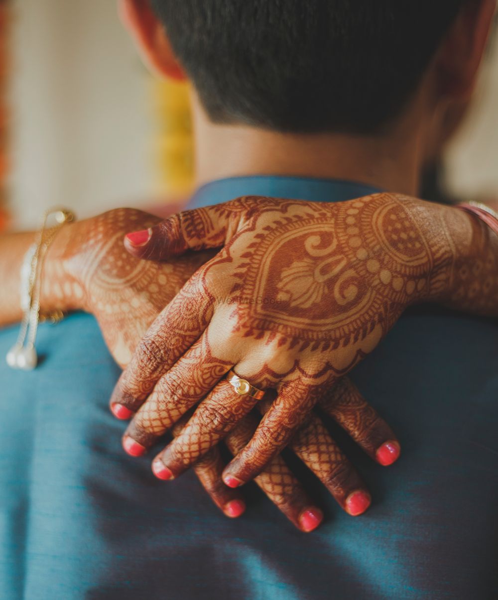 Photo of Engagement announcement photo with ring on mehendi hands
