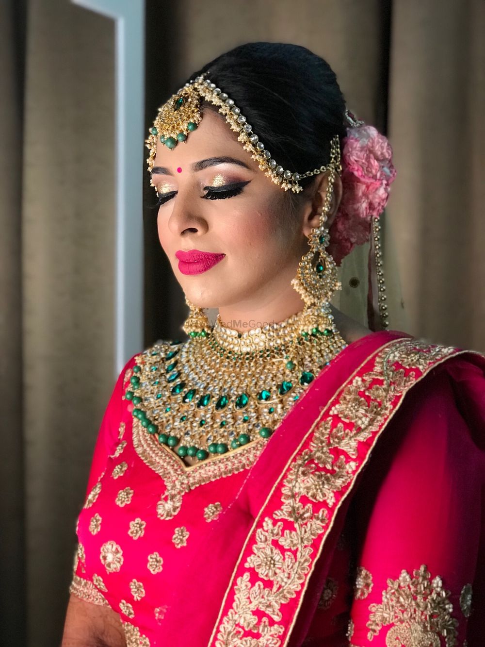 Photo of A bride in hot pink lehenga