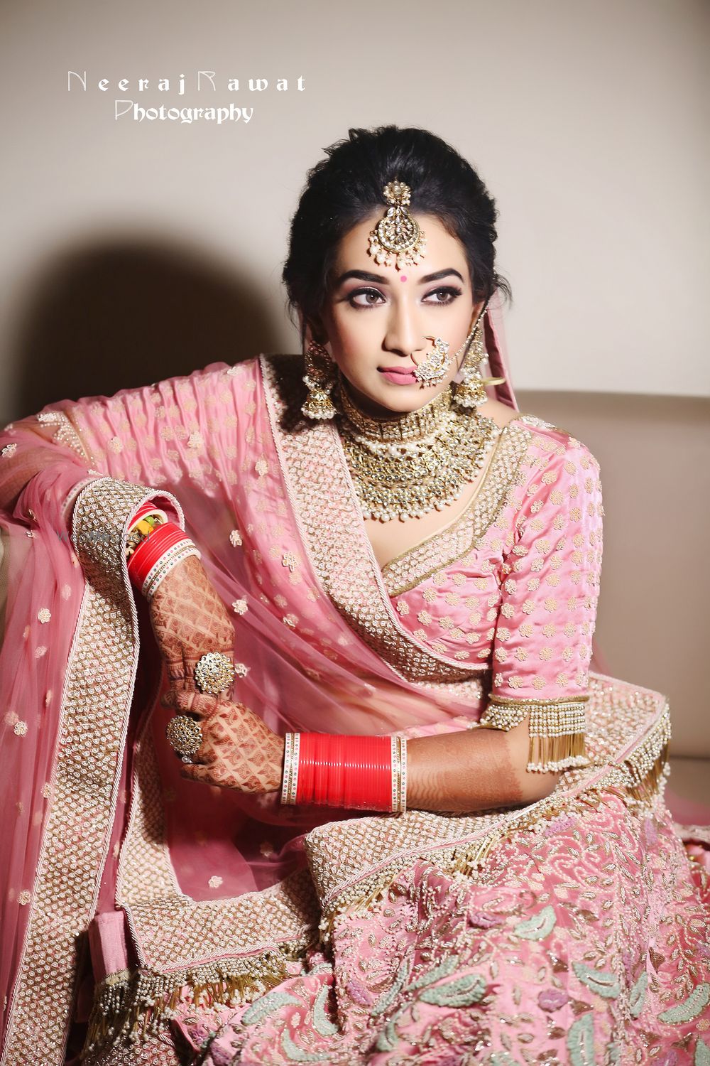 Photo of Bride in pink lehenga and tassel blouse