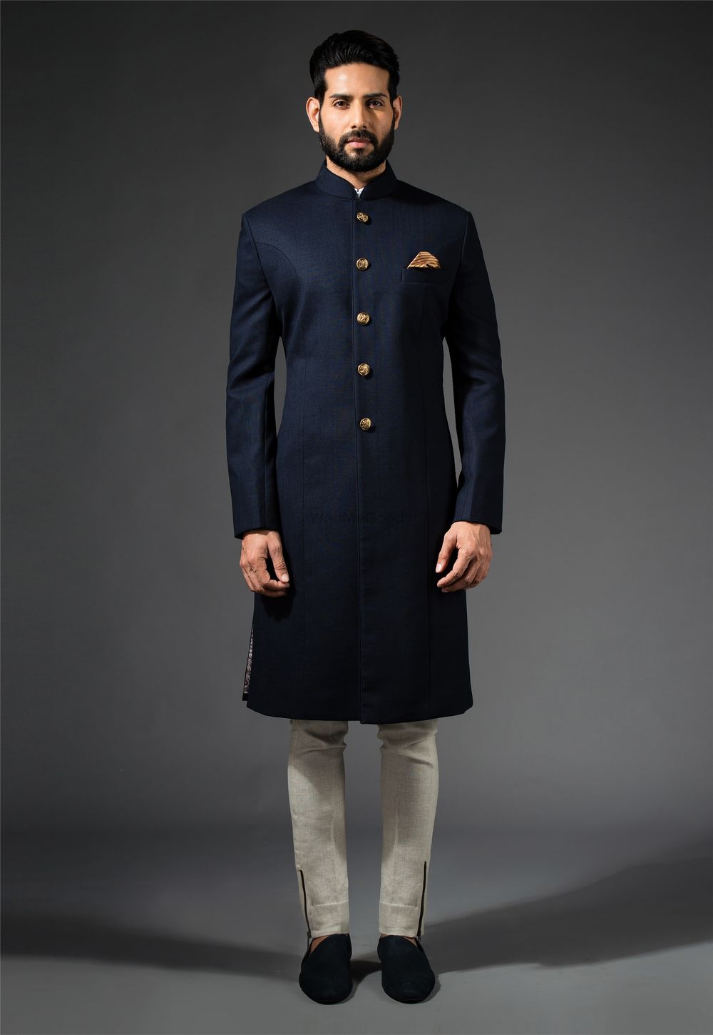 Photo of blue and gold sherwani