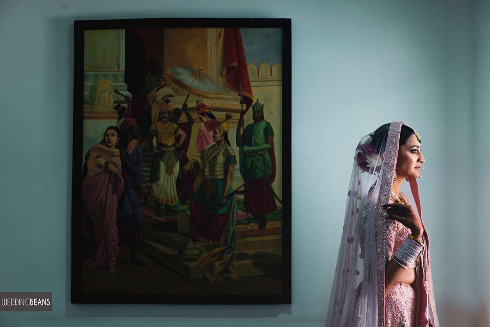 Photo of Bridal portrait in a light pink lehenga in bridal room