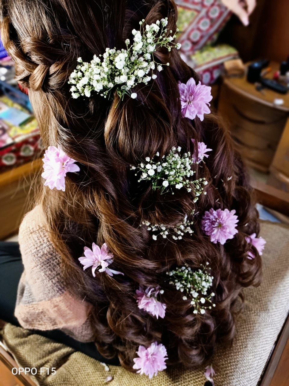 Photo of Half up half down hairstyle with baby's breaths and lavender flowers.