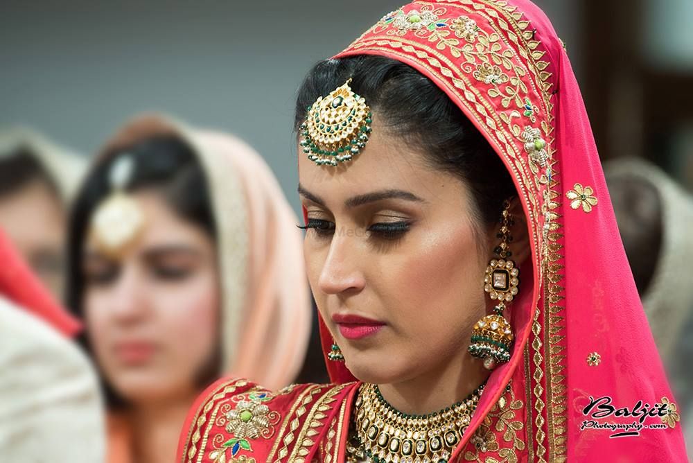Photo of Pink Bride with Gold and Emerald Maangtikka