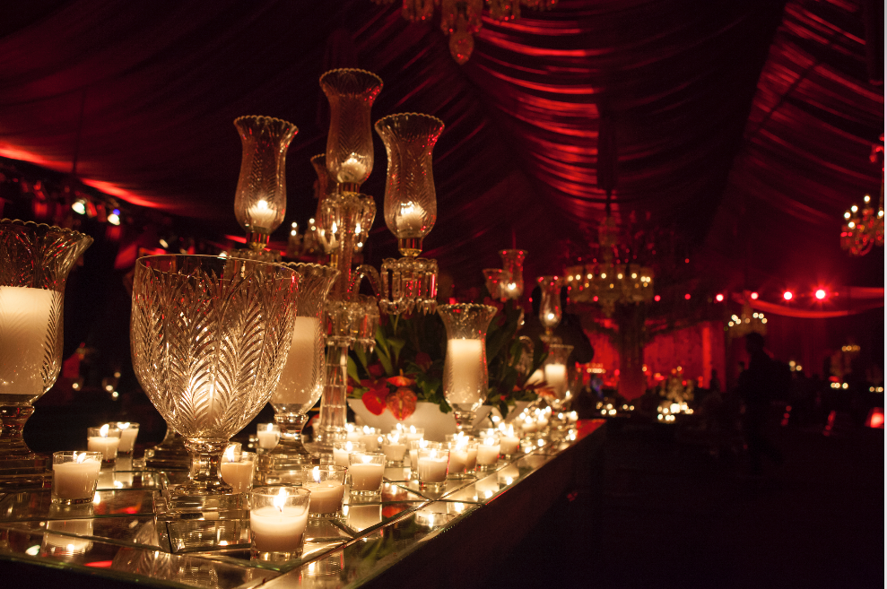 Photo of Dimly lit cocktail decor with candelabaras