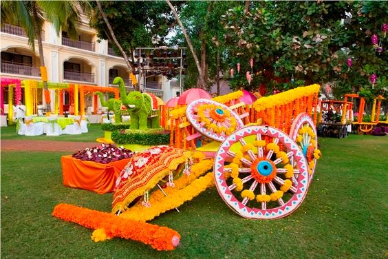 Photo of Pretty decorated bullock cart with flowers as a mehendi photo booth