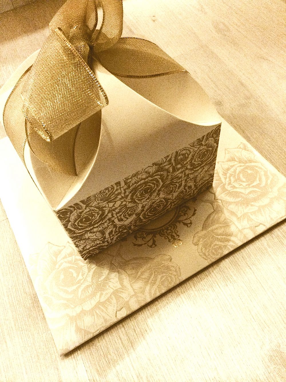 Photo of elegant gold and white damask cards with box and bow