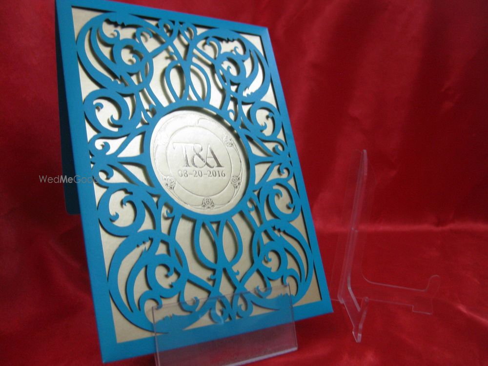 Photo of Blue laser cut wedding invitation card