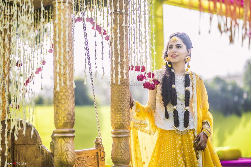 Photo of Bridal mehendi portrait with yellow outfit