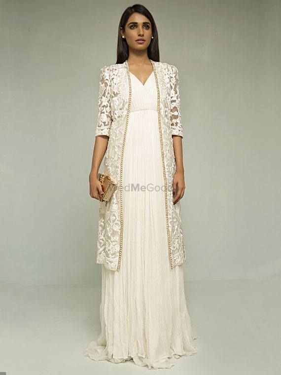 Photo of lace white and gold embellished jacket with white gown