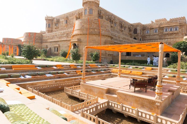 Photo of Palace Wedding Venue Outdoor Orange Mandap and Seating