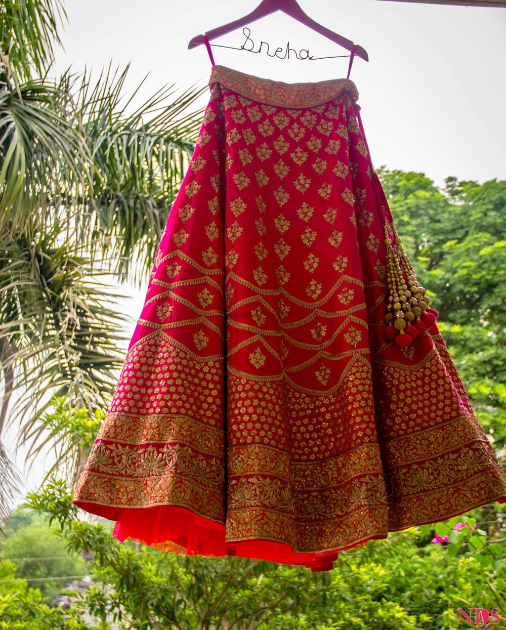 Photo of Bright Pink and Red Lehenga on Personalised Hanger