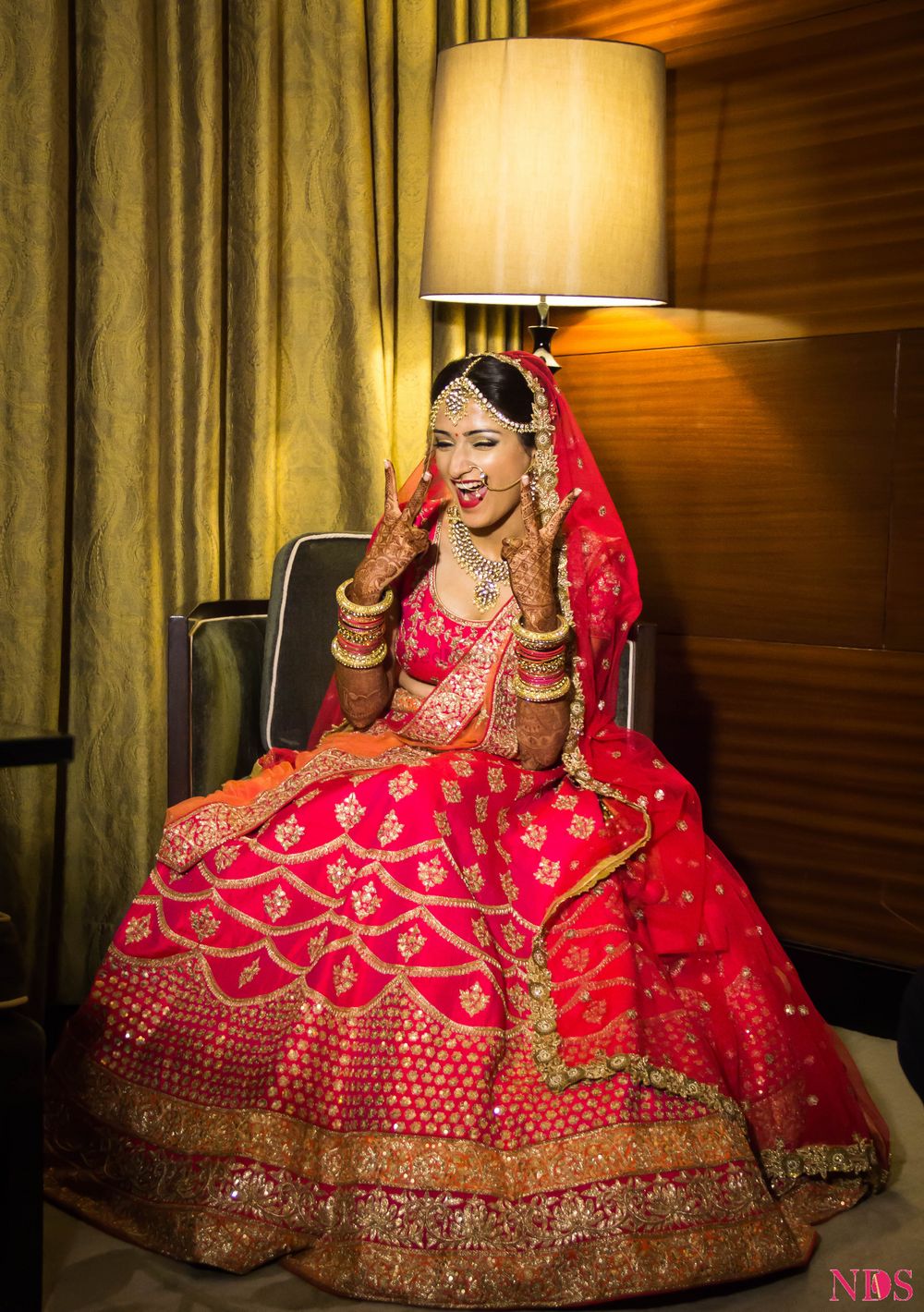 Photo of Fun Bridal Portrait with Bride in Hot Pink Lehenga
