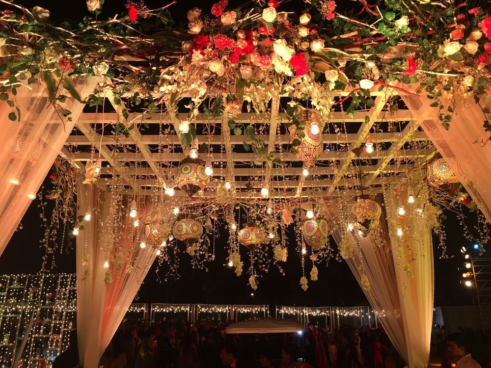Photo of Beautiful floral decor with hanging lights