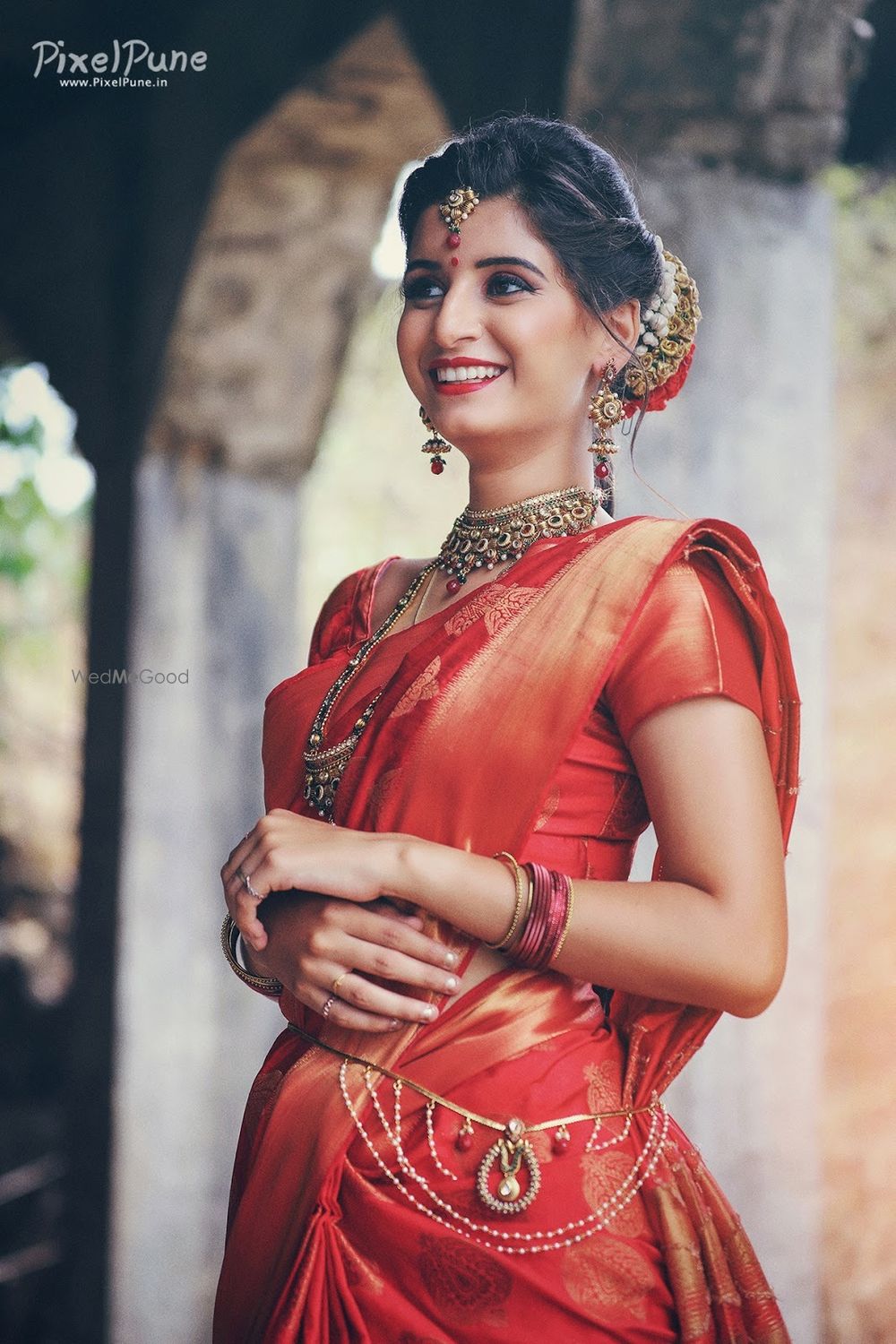 Photo of orange and red bridal saree for south indian bride