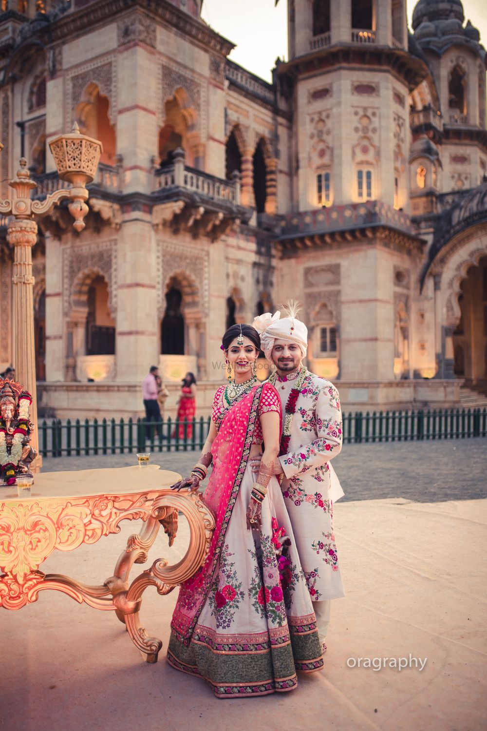 Photo of Twinning bride and groom in floral sherwani