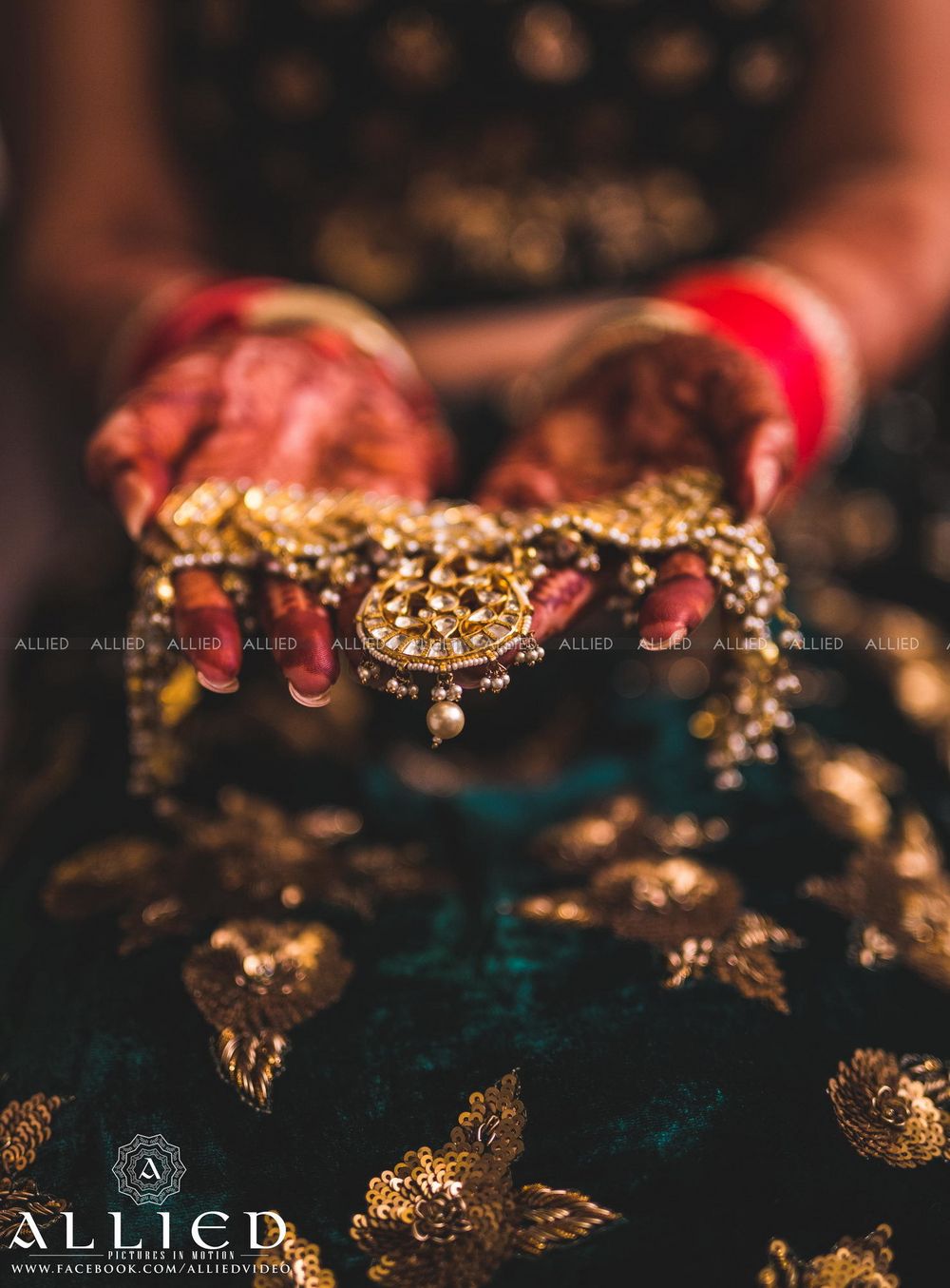 Photo of Bride holding her  mathapatti with pearls