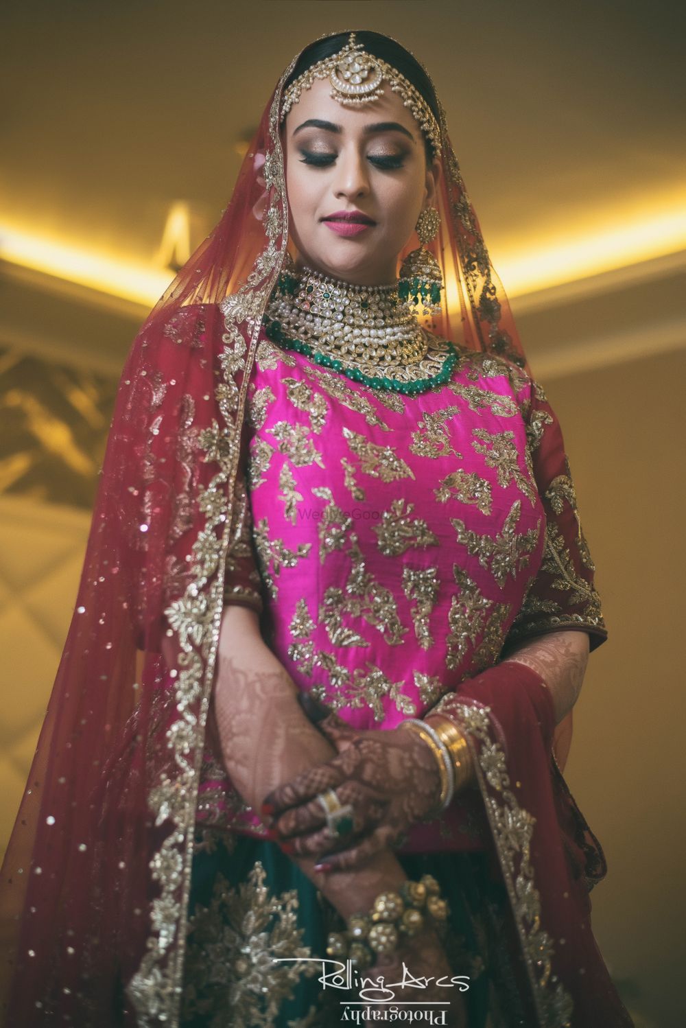 Photo of Bride in pink and green lehenga on her wedding day