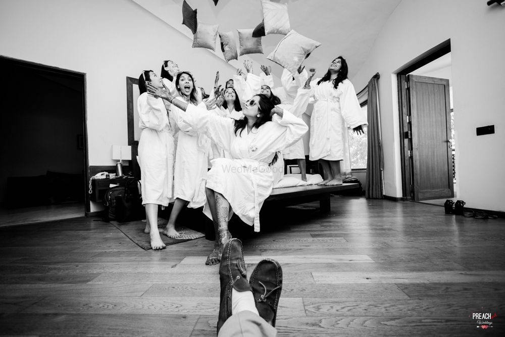 Photo of Bride with Bridesmaids in Pillow Fight