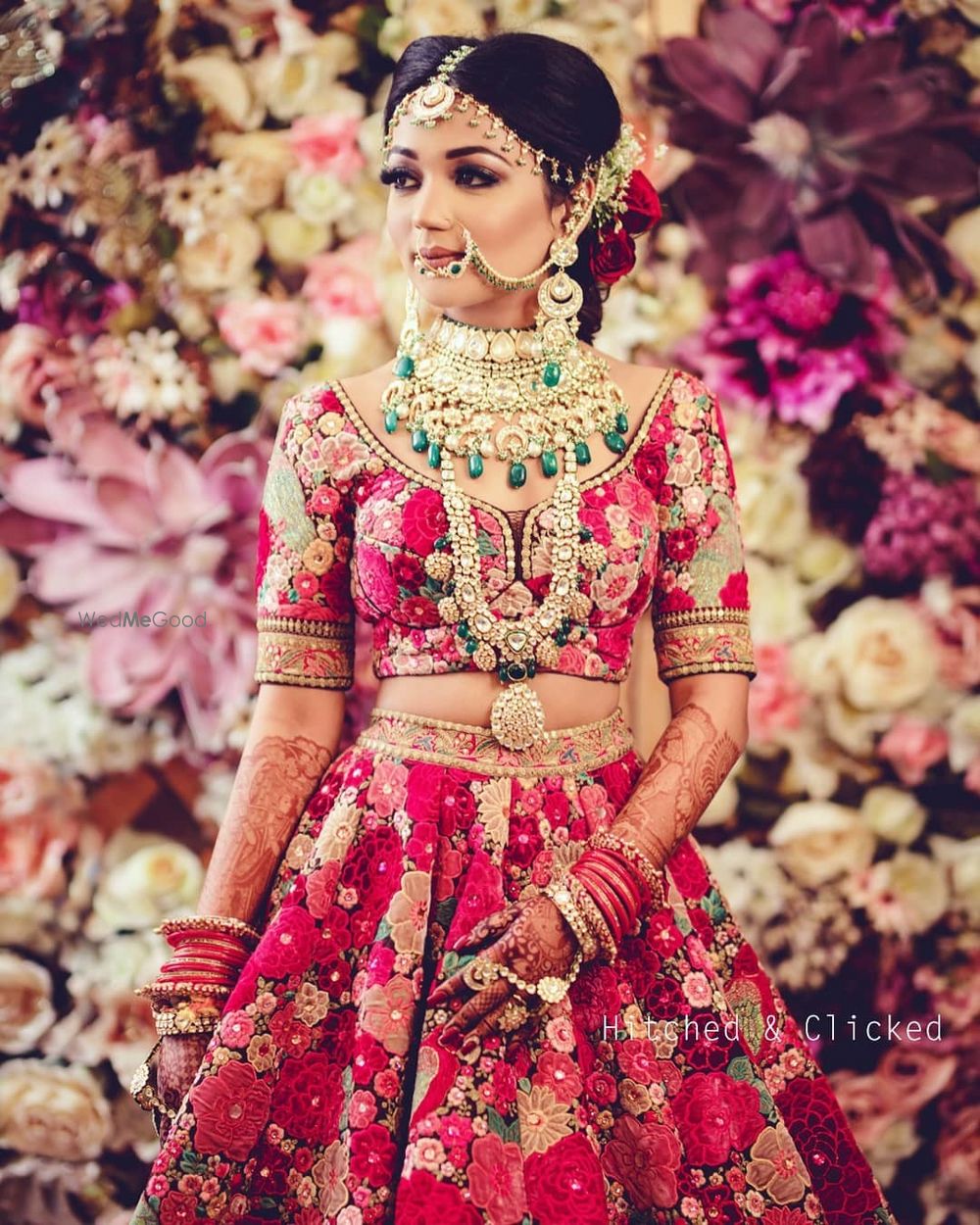 Photo of bride wearing sabyasachi bridal lehenga with layered polki necklaces