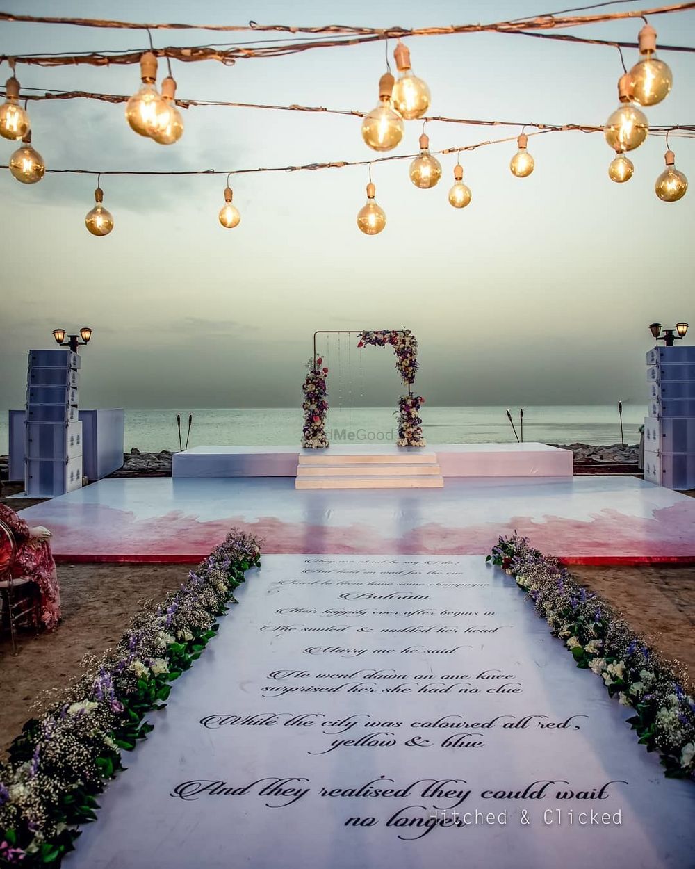 Photo of personalised mandap decor with a printed aisle and stage setup