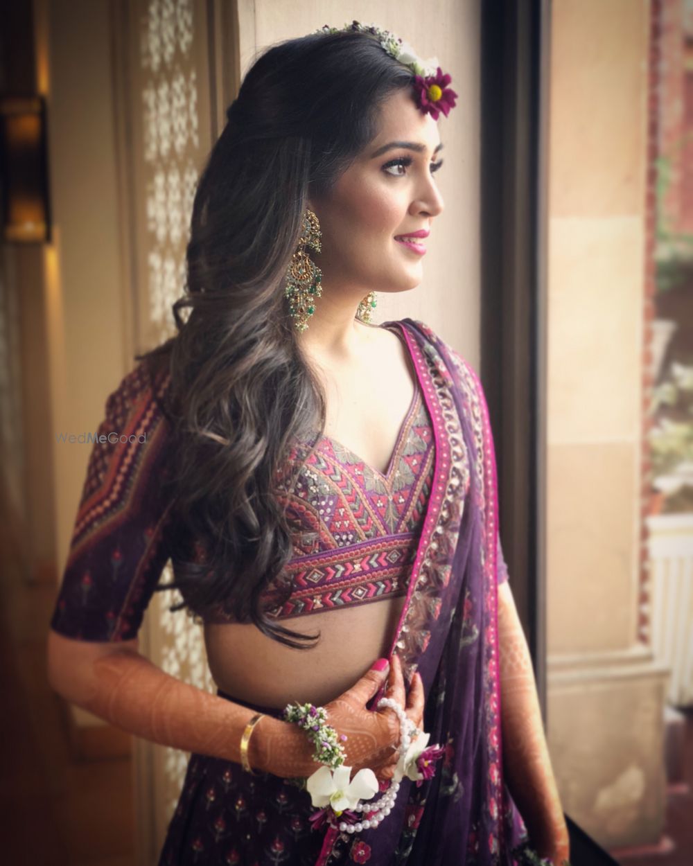 Photo of Mehendi bridal look in purple lehenga