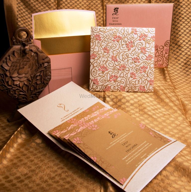 Photo of Light pink and bronze invitations