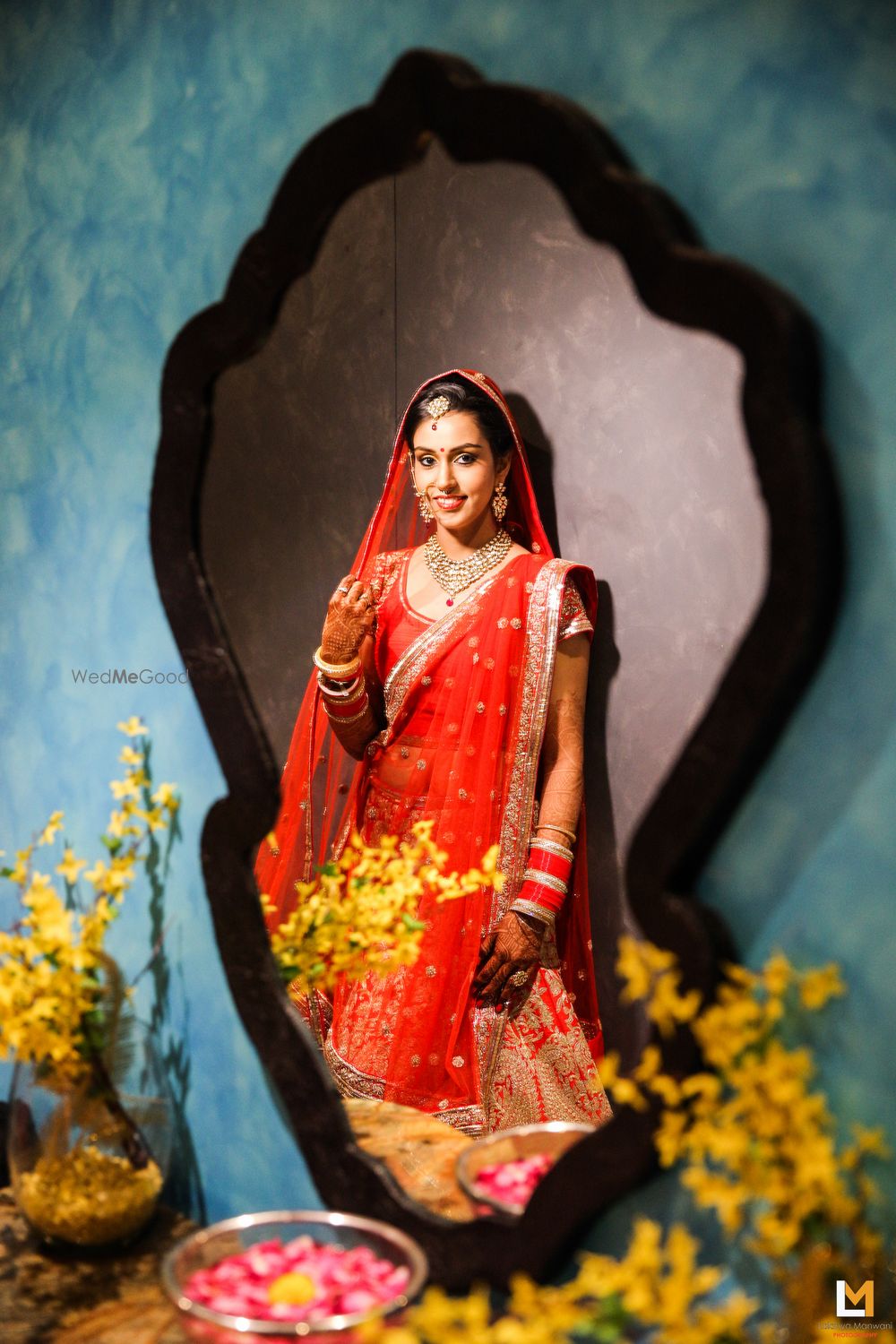 Photo of Bride Looking Through the Mirror Shot