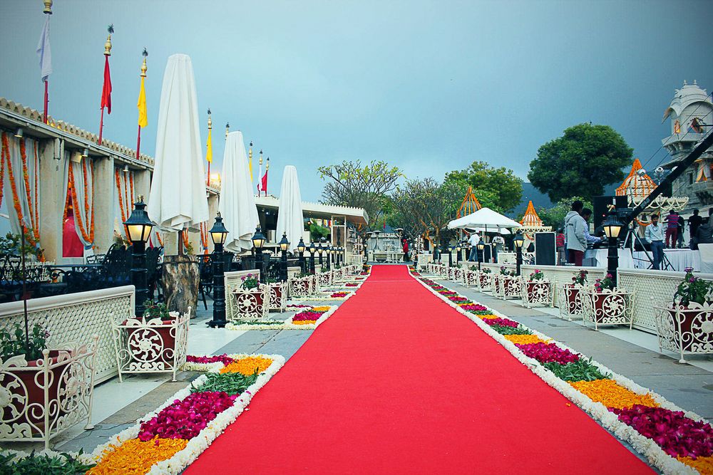Photo of Red Carpet Entrance Decor with Floral Arrangement
