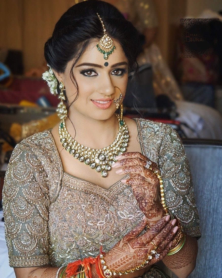 Photo of Bridal bun with flick and peach lips