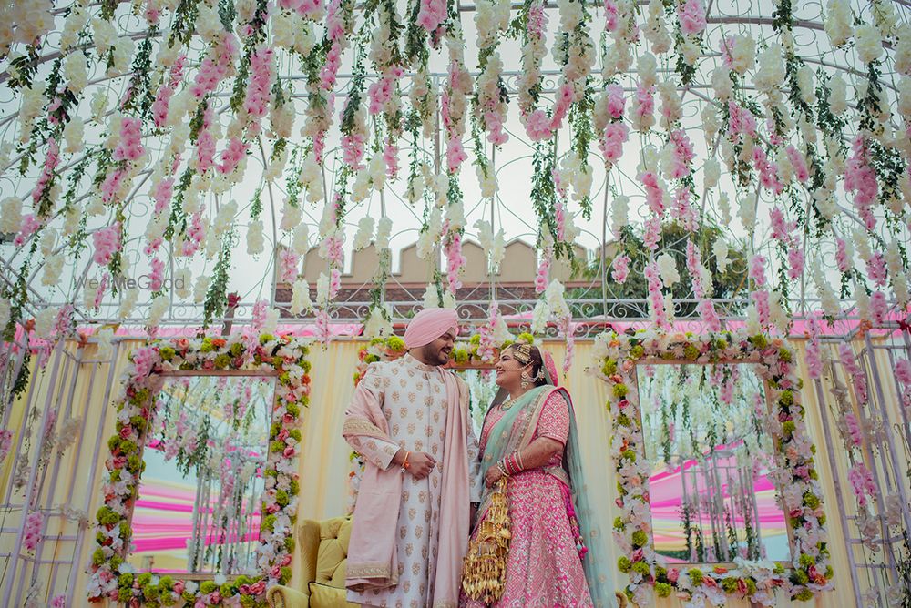 Photo of Pastel couple and decor with floral strings