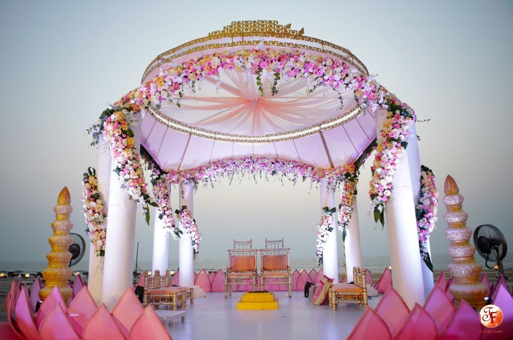 Photo of Simple white and pink mandap in open