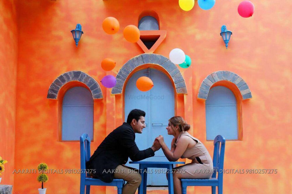 Photo of Cute Pre Wedding Shoot with Balloons in Cafe Setting