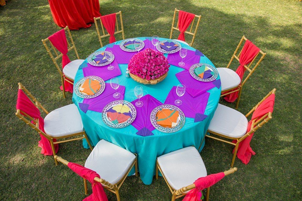 Photo of Colourful Quirky Kite Themed Round Table Setting