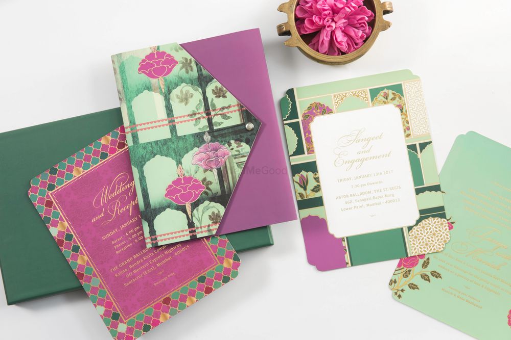Photo of Purple and green wedding card with modern floral design
