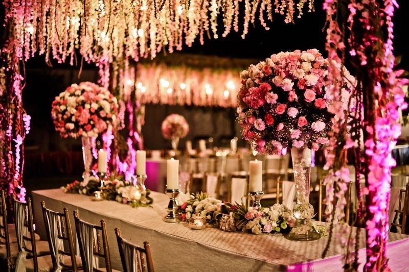 Photo of Light pink and white theme floral table decor