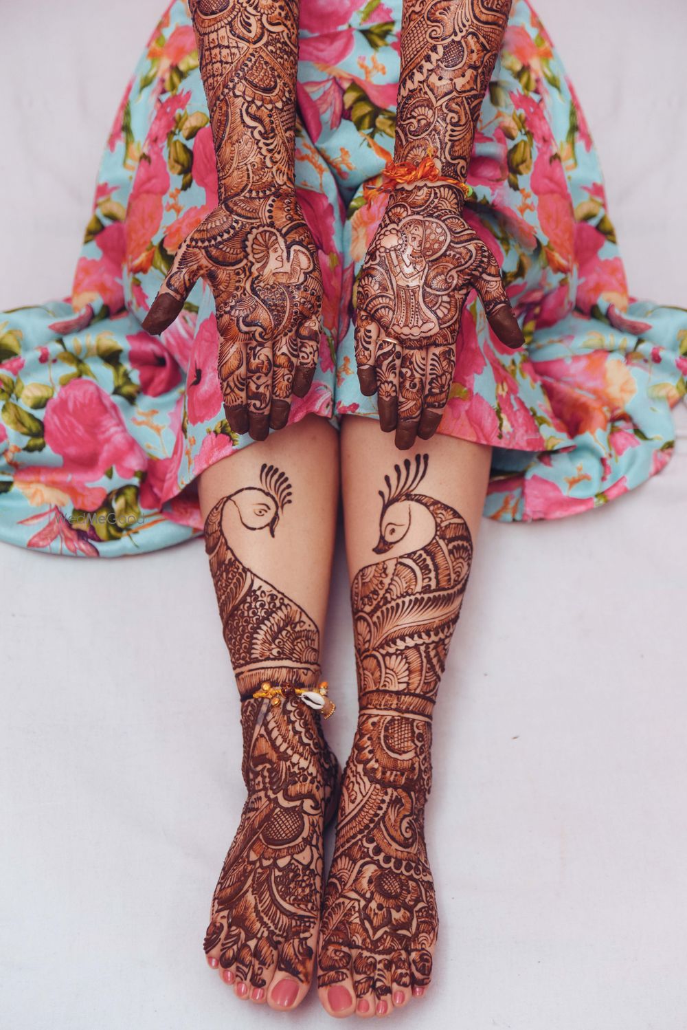 Photo of Peacock theme mehendi on hands and feet