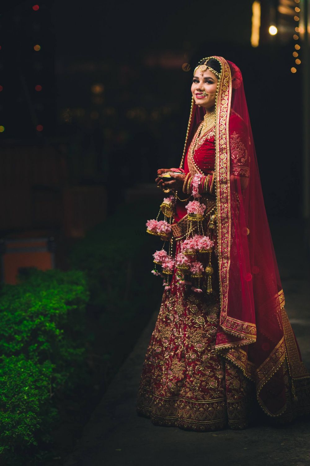 Photo of Light pink floral kaleere with red bridal lehenga