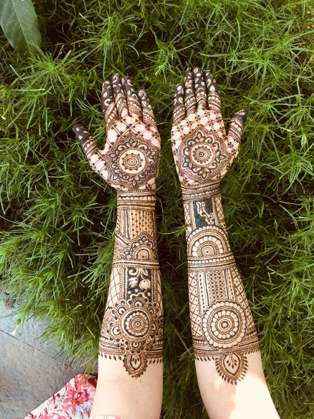 Photo of Traditional mehndi design with bride and groom's initials.