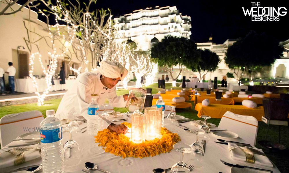 Photo of white and yellow table centerpieces