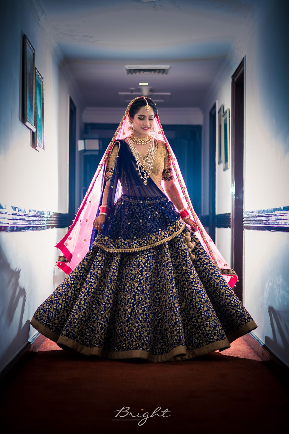 Photo of Offbeat bridal lehenga in blue with pink dupatta