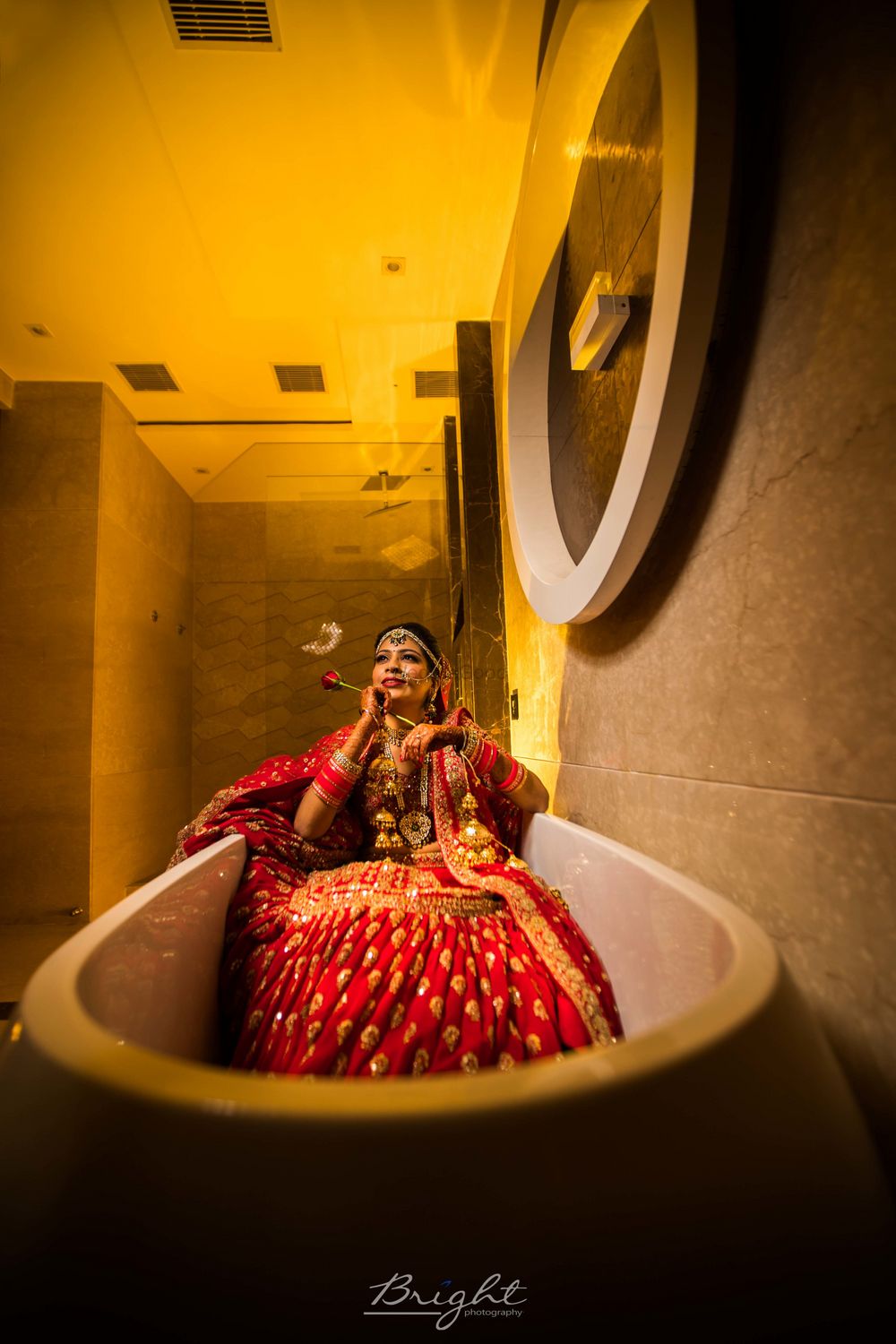 Photo of Bride chilling in bathtub shot before wedding