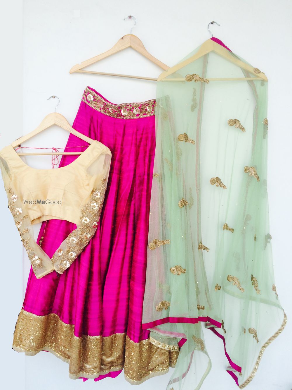 Photo of pink raw silk lehenga with mint dupatta