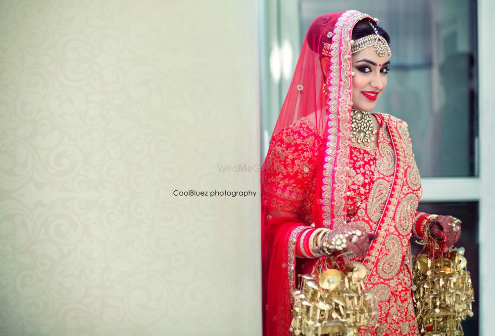 Photo of Red Bride with Gold Kaleere